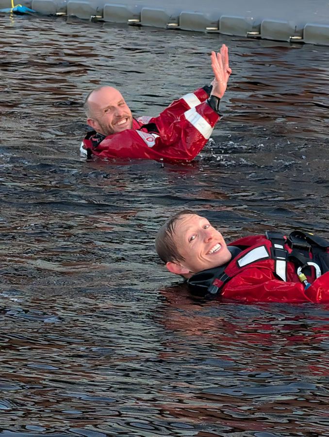 Two Tees River Rescue crew demonstrating floating on their backs
